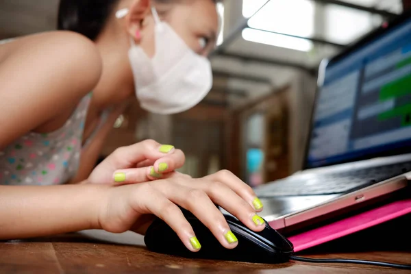 Southeast Asian Teenage Girl Face Mask Home Schooling Using Laptop Stock Image