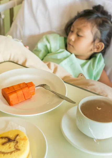 Sick Asian Child Hospital Patient on Bed with Fruit Menu Served on Bed — Stock Image Sick Asian Child Hospital Patient on Bed with Fruit Menu Served on Bed Royalty Free Stock Images