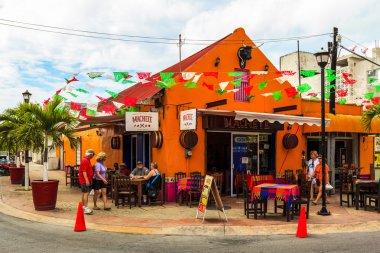 Colorful souvenirs, coffee shops located in Cozumel.  Mexico clipart