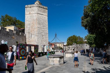 Zadar, Croatia - Sept. 14, 2019: People's Square in Zadar was established in medieval times as the Plateau magna (big square), the center of the city administration with today's City Lodge, City Guard clipart