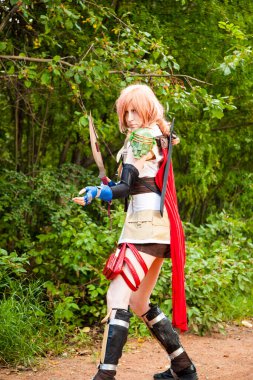 Calgary, Canada - September 01, 2014: Cosplayer dressed up as Viking warrior girl with sword fight.