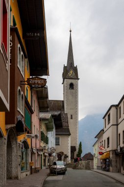 Golling, Austria -  April 12, 2019: Main street of the town, with traditional illustrative painting on the facades.