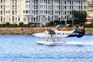 Victoria, BC, Canada - Jun 21 2019: Harbor Air Float-plane in the inner harbor. This transportation is vital and very frequent between Victoria and Vancouver