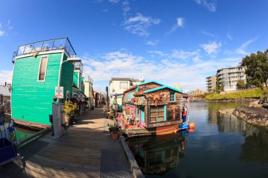 VICTORIA BC CANADA - JUNE 24 2016: Victoria Inner Harbor, Fisherman Wharf is a hidden treasure Area has floating homes, boats, piers, and restaurants and eco-tour adventures