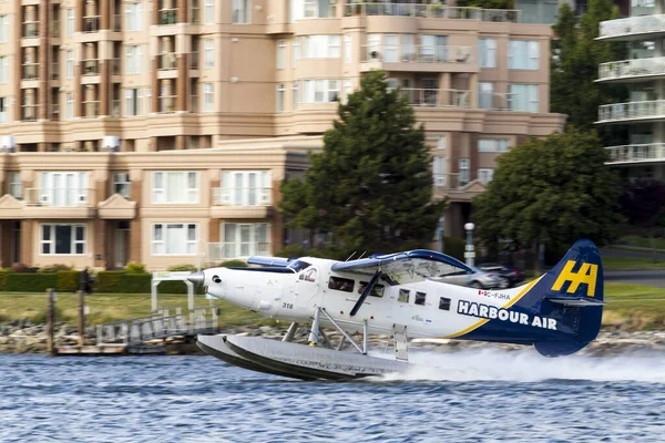 Victoria, BC, Canada - Jun 21 2019: Harbor Air Float-plane in the inner harbor. This transportation is vital and very frequent between Victoria and Vancouver