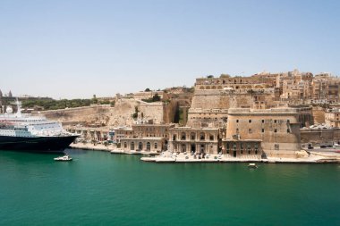 Malta Valletta - May 20 2009: View of Valletta's Grand Harbor with architecture. Valletta is the capital city of Malta and has the population of 6,444. Founded in 1565 by the Order of St John