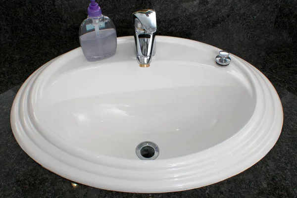 White Sink Black Handle Gray Background — Stock Photo, Image