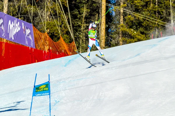 LAKE LOUISE, ALBERTA CANADA - OCT.29.2015. : 64 official entry speeds down the course during the Audi FIS Alpine Ski World Cup Men's race. The average speed is 132 km/h during the race. — Stock Photo, Image