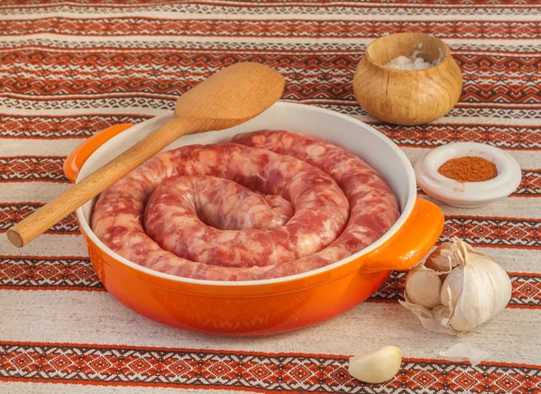 Ring of raw sausage with pepper — Stock Photo, Image