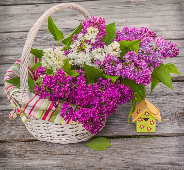 Basket with lilac — Stock Photo, Image