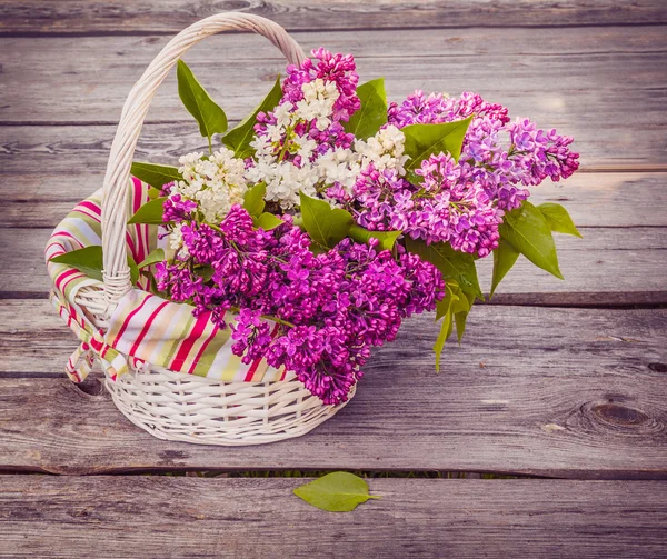 Basket with lilac — Stock Photo, Image