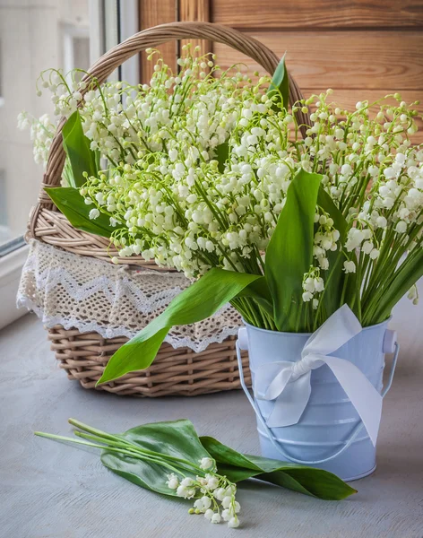 Basket with lilies of the valley — Stock Photo, Image