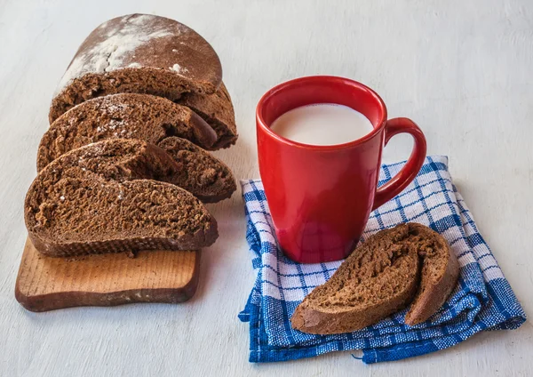 Bread Tabatiere and   cup with milk — Stock Photo, Image