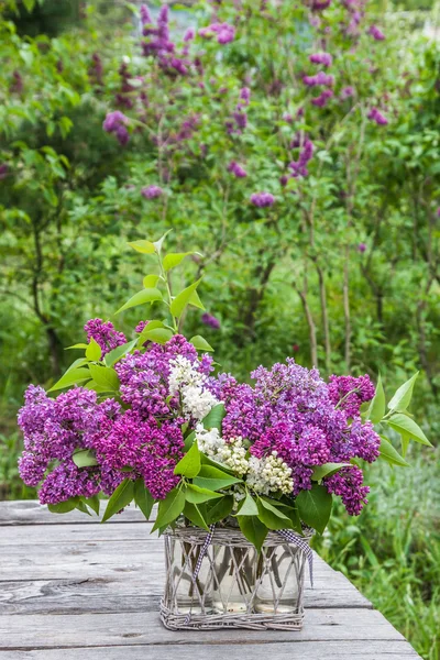 Bouquet of lilac on the table — Stock Photo, Image