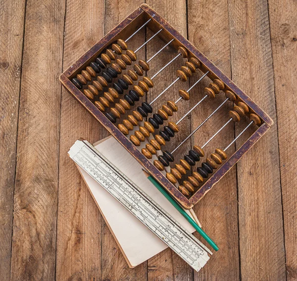 Old abacus,  paper with a pencil — Stock Photo, Image