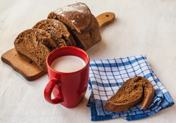 Bread Tabatiere and  cup with milk — Stock Photo, Image