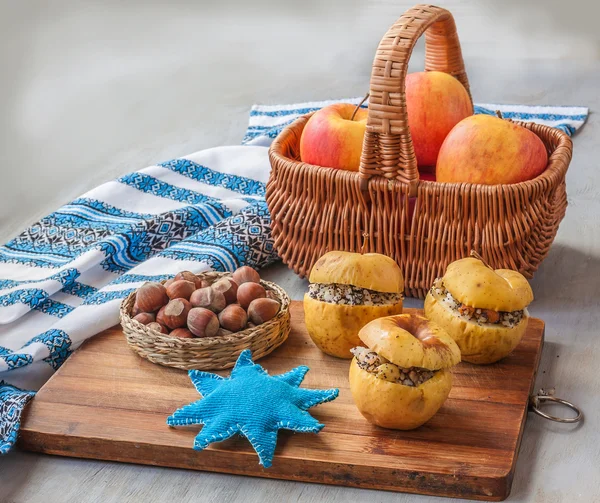 Apples with nuts in basket — Stock Photo, Image