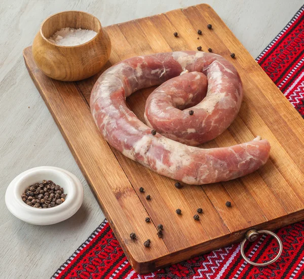 Ring of sausage with spices — Stock Photo, Image