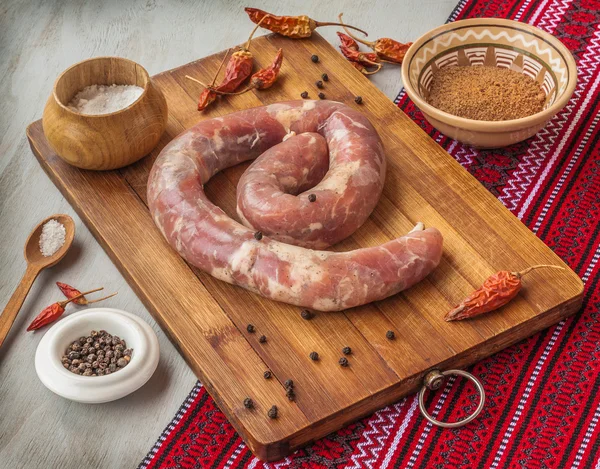 Ring of sausage with spices — Stock Photo, Image