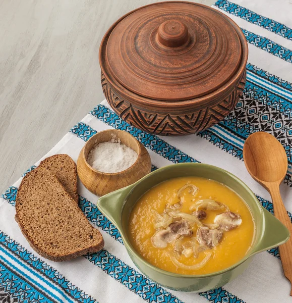 Pumpkin soup with fried onions and meat with bacon — Stock Photo, Image