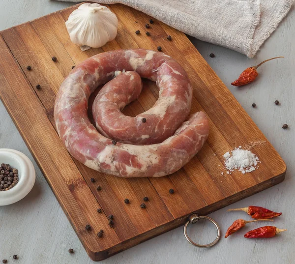 Ring of raw sausage — Stock Photo, Image