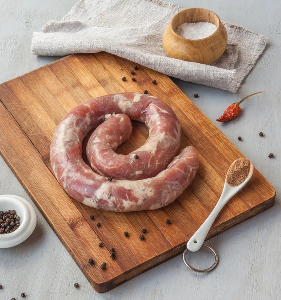 Ring of raw sausage — Stock Photo, Image