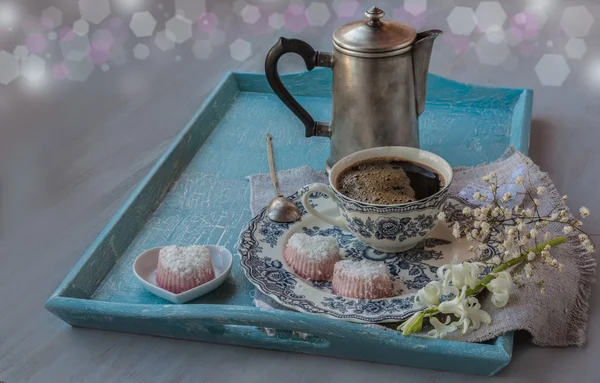 Tray with a coffee pot, cup of coffee, flowers and candies — Stok Foto