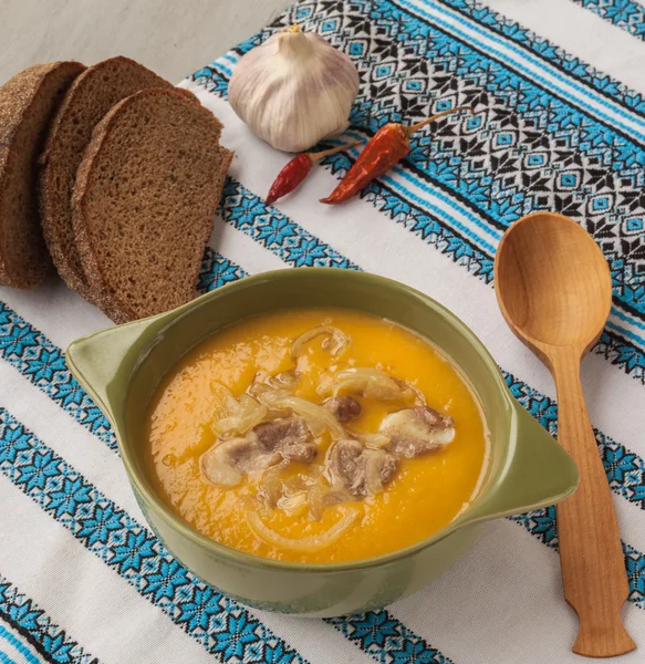 Pumpkin soup with fried onions and meat — Stock Fotó