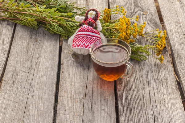 Drink from tansy and folk doll — Stock Photo, Image
