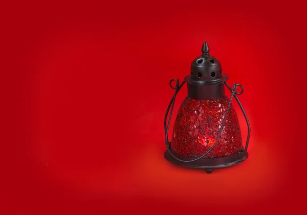 Glass lamp on a red background — Stock Photo, Image