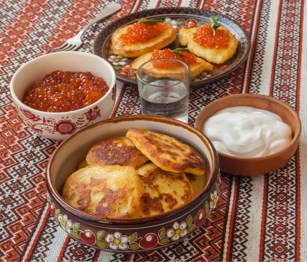 Thick potato pancakes and red caviar — Stock Photo, Image