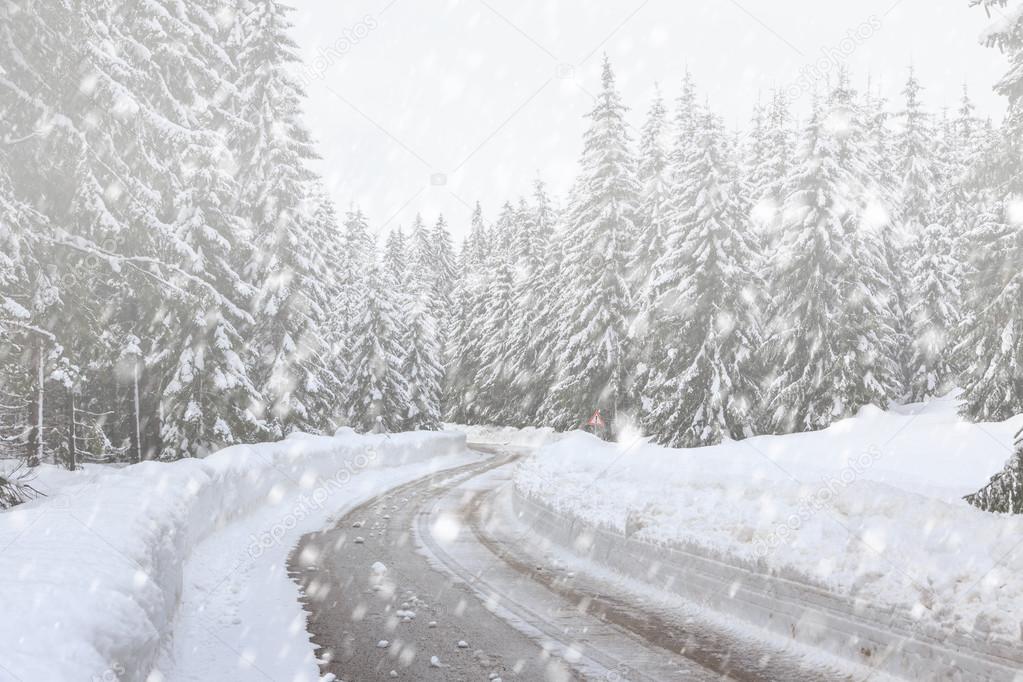  Snowy winter road in Slovenia