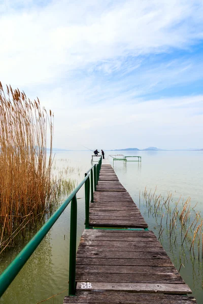 Wooden pier in tranquil lake Balaton — Stock Photo, Image