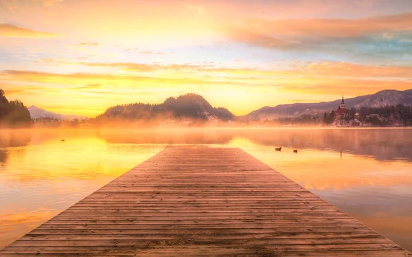 Amazing sunrise at the lake Bled in winter — Stock Photo, Image