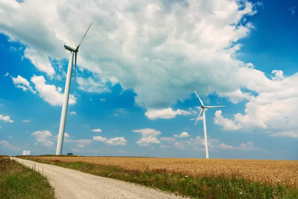 Wind generators turbines on wheat field — Stock Photo, Image