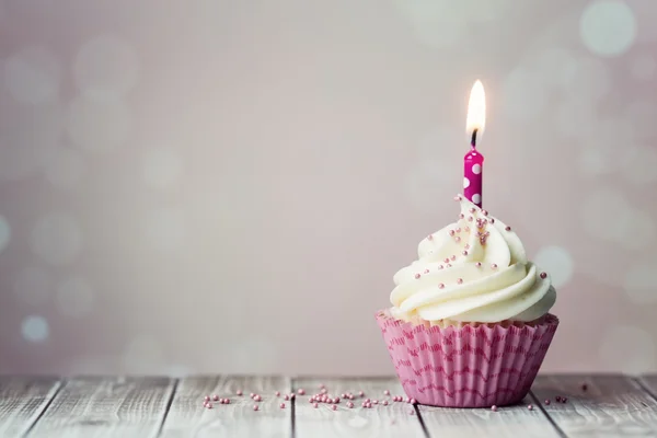 Birthday cupcake with one candle Stock Picture