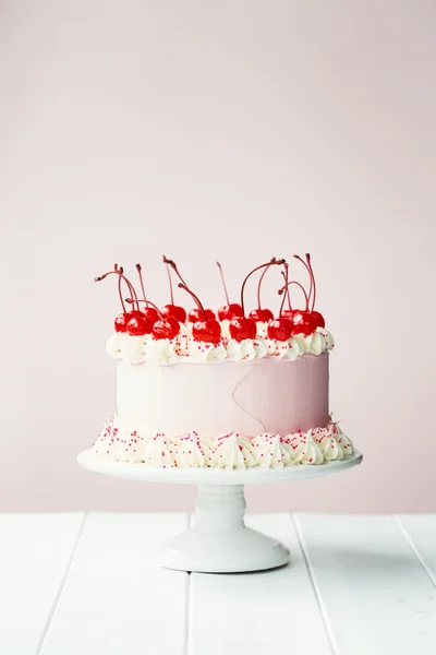 Cake decorated with maraschino cherries — Stock Photo, Image