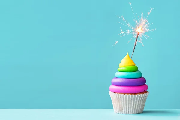 Colorful cupcake with sparkler — Stock Photo, Image
