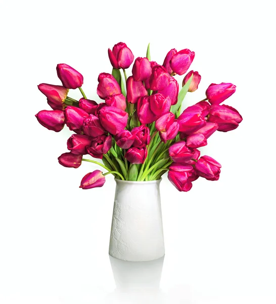 Bouquet of red tulips in white vase — Stock Photo, Image