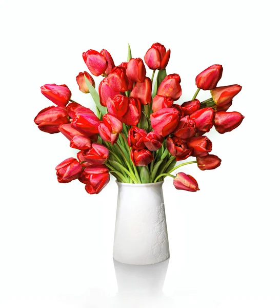 Bouquet of red tulips in white vase — Stock Photo, Image