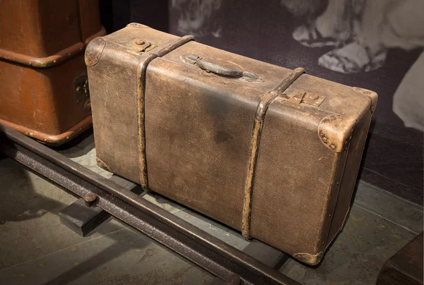 Vintage suitcase on grey background