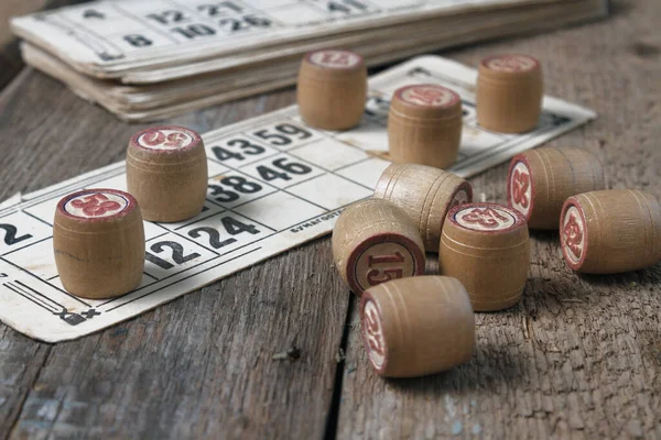 An old board game lying on a wooden table. Still life, objects