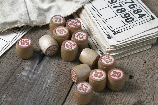 An old board game lying on a wooden table. Still life, objects