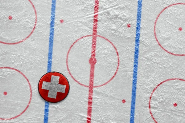 Swiss hockey puck on the site — Stock Photo, Image