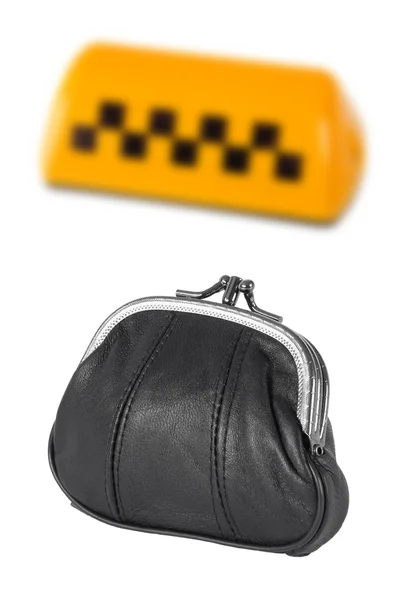 Un panneau de taxi et un sac à main en cuir — Photo
