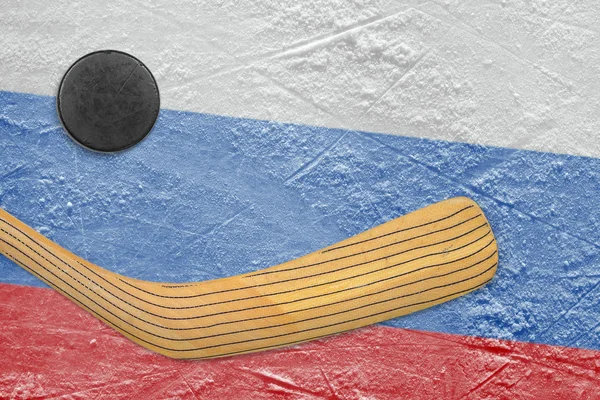 Hockey puck, hockey stick and a Russian flag — Stock Photo, Image