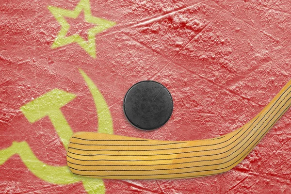 Hockey puck, hockey stick and the Soviet flag — Stock Photo, Image