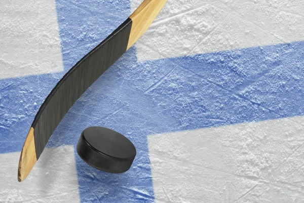 Hockey puck, hockey sticks and ice rink — Stock Photo, Image