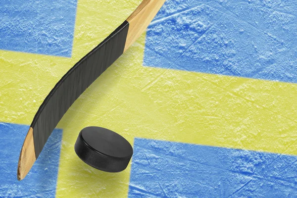 Hockey puck, hockey sticks and ice rink — Stock Photo, Image