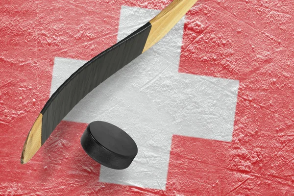 Hockey puck och klubba — Stockfoto